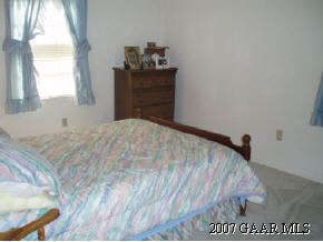 6415 Spring Hill Road Ruckersville, VA 22968 - Photo 10 of 12 a bedroom with a bed and a dresser