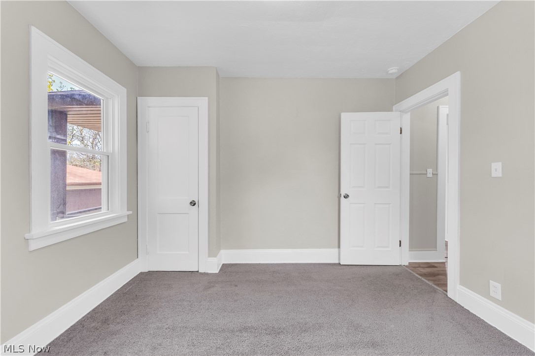 18123 McCracken Road Maple Heights, OH 44137 - Photo 17 of 27 Neutral wall tones complement the gray carpeting