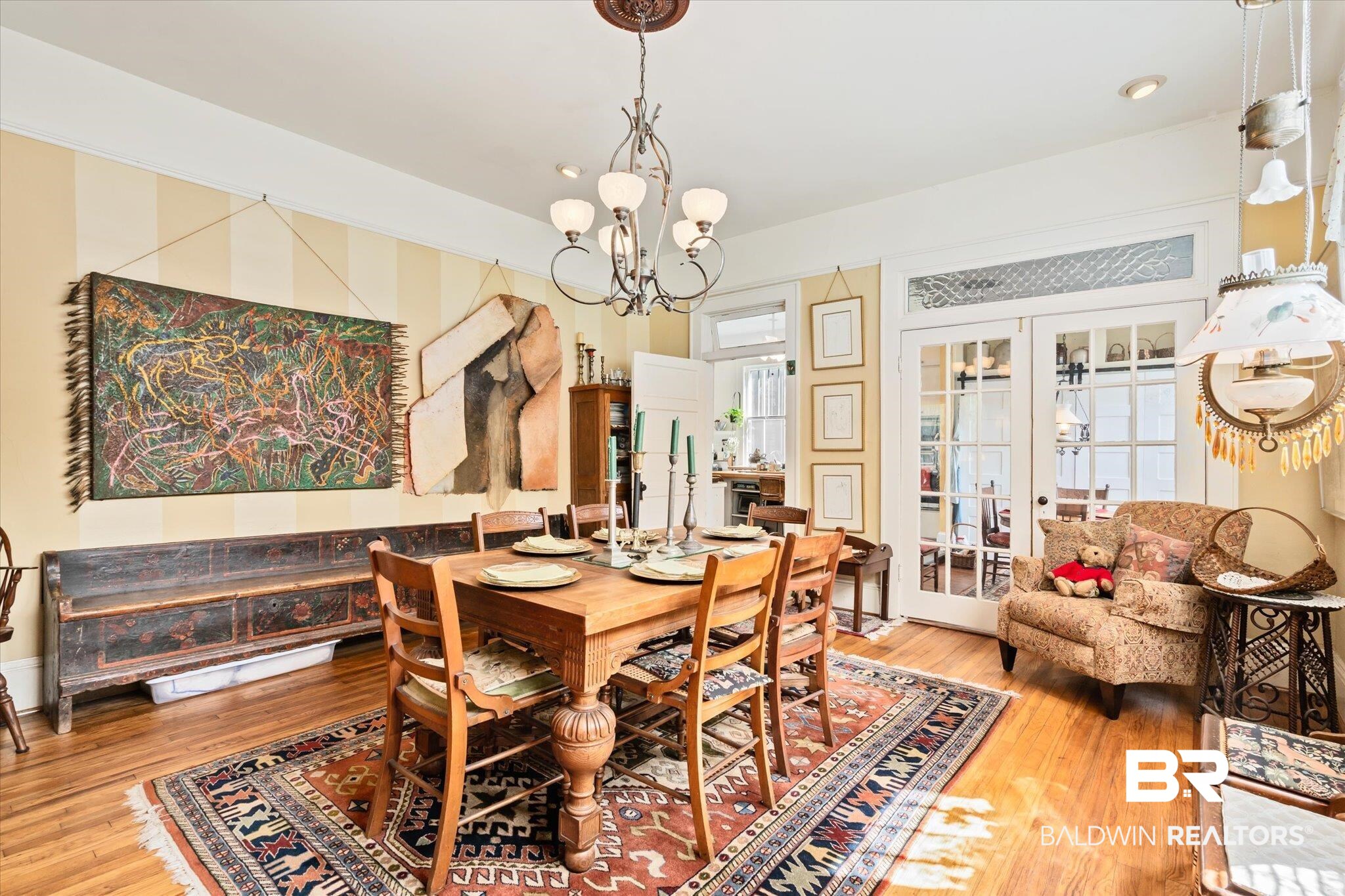 12 Lebaron Street Mobile, AL 36602 - Photo 7 of 37 Dining room featuring a chandelier, hardwood / wood-style flooring, and french doors