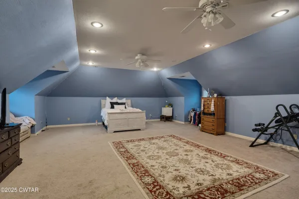 a room with furniture and a flat screen tv