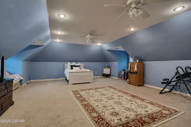 a room with furniture and a flat screen tv