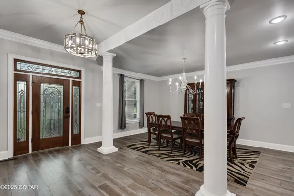 a view of a dining room with furniture window and wooden floor