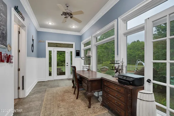 a view of a livingroom with furniture window and outside view