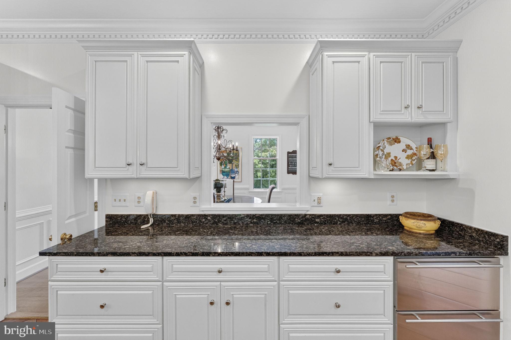 4531 Den Haag Road Warrenton, VA 20187 - Photo 33 of 103 a kitchen with granite countertop white cabinets and sink