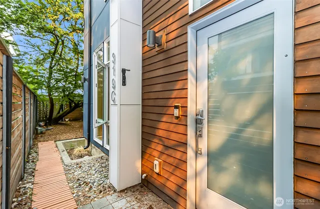 a bathroom with a glass door shower