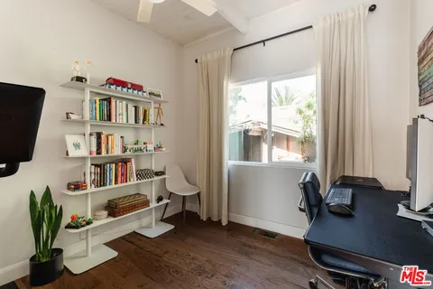 a workspace with furniture and window