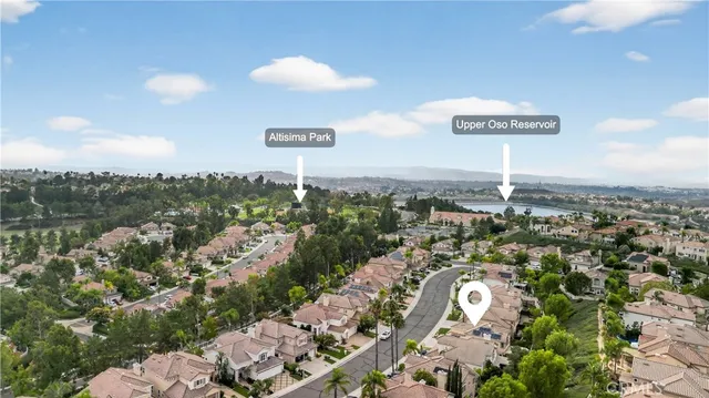 a living room with furniture kitchen view and a fireplace