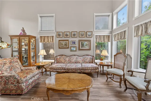 a view of a dining room with furniture wooden floor and chandelier