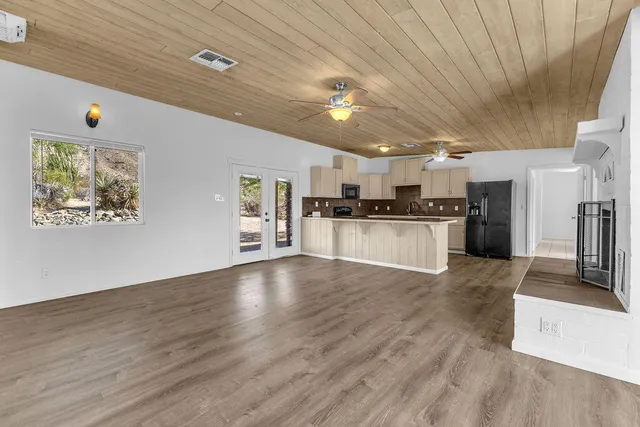 a large kitchen with cabinets and stainless steel appliances
