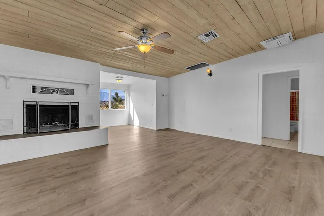 a kitchen with granite countertop a sink stainless steel appliances and cabinets