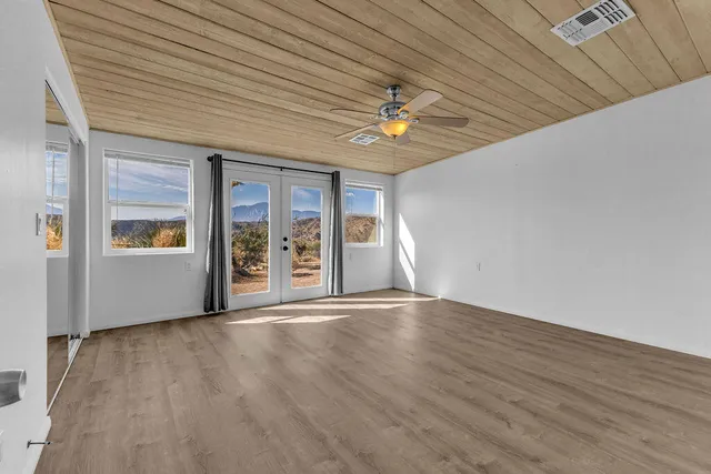 a view of a room that has a large window