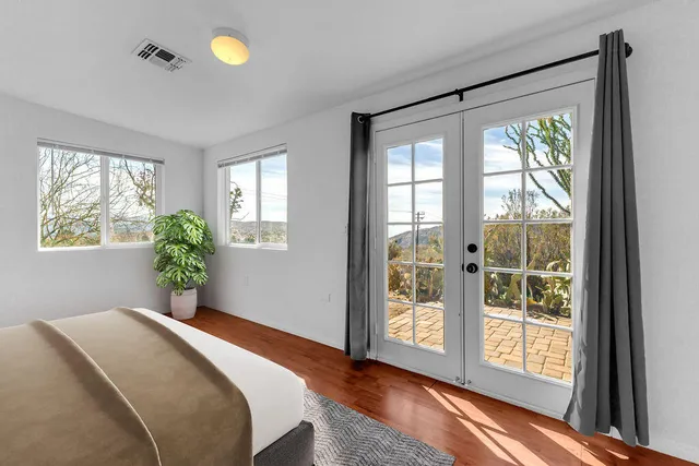 a view of a mountain range with trees in the background