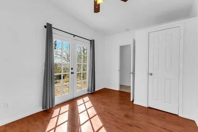 a view of a dry yard with mountains in the background