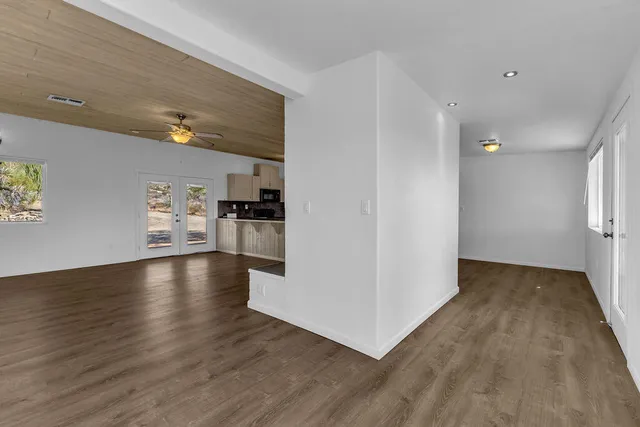 a view of a kitchen with a microwave and a stove top oven