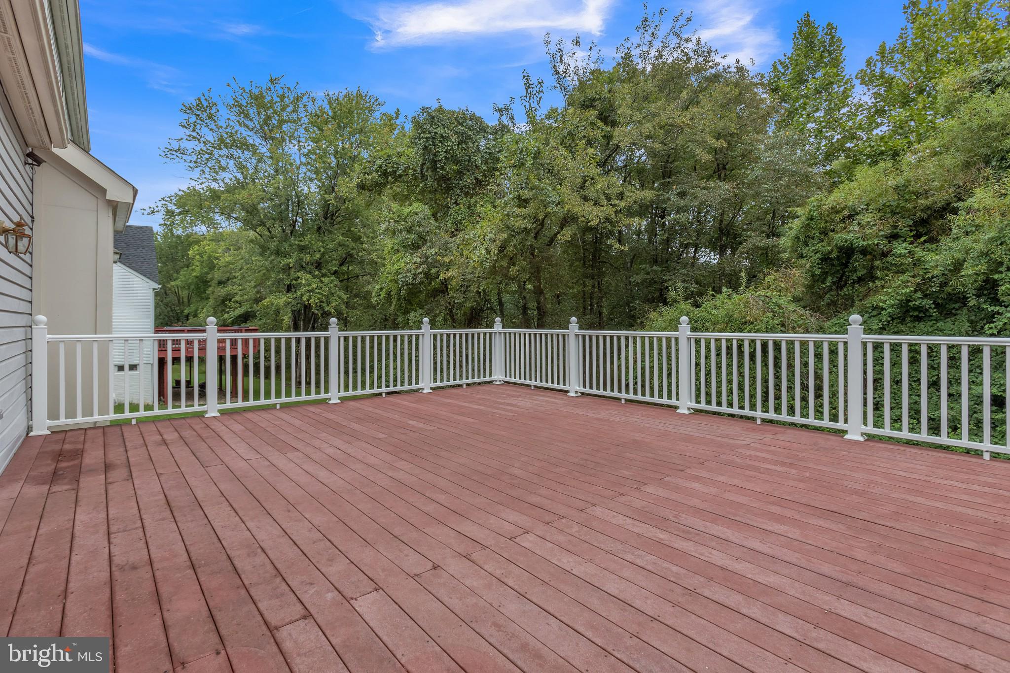 13907 Willow Tree Drive Rockville, MD 20850 - Photo 15 of 30 a view of a wooden deck