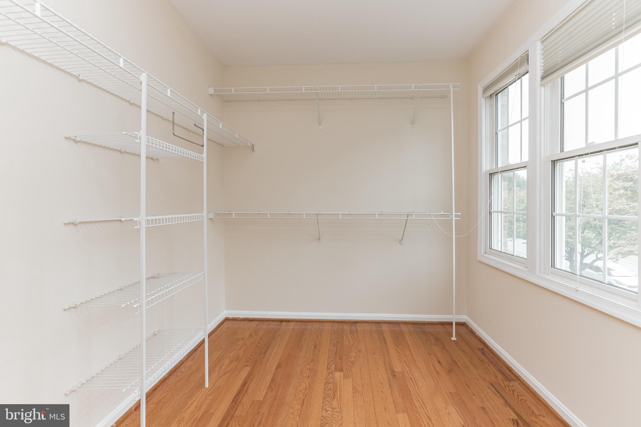 13907 Willow Tree Drive Rockville, MD 20850 - Photo 20 of 30 a view of a room with wooden floor and a window