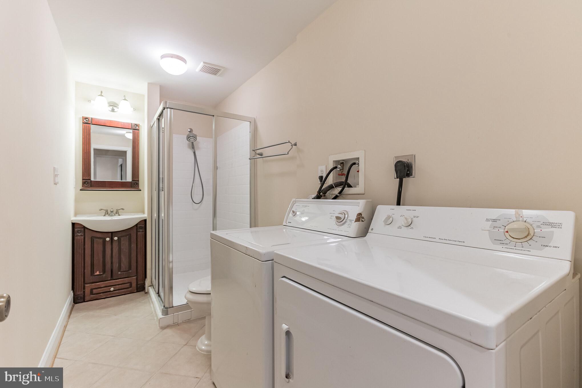 13907 Willow Tree Drive Rockville, MD 20850 - Photo 29 of 30 a utility room with dryer and washer