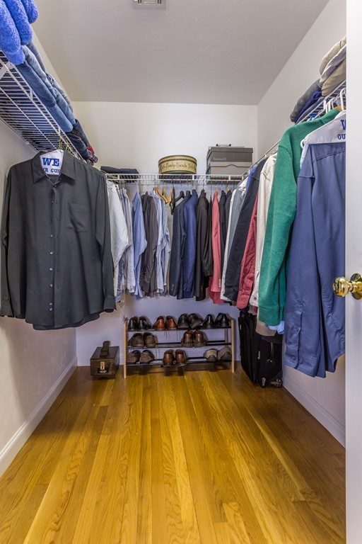 47 Crescent Road, Unit 47 Needham, MA 02494 - Photo 11 of 17 a view of walk in closet with clothes and shoes