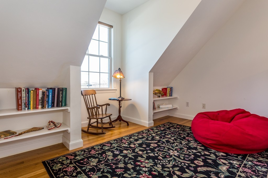 47 Crescent Road, Unit 47 Needham, MA 02494 - Photo 14 of 17 a room with furniture and a book shelf