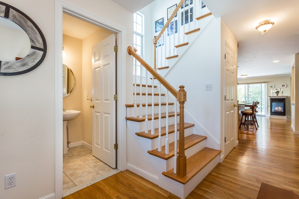 47 Crescent Road, Unit 47 Needham, MA 02494 - Photo 2 of 17 a view of a hallway with wooden floor and entryway