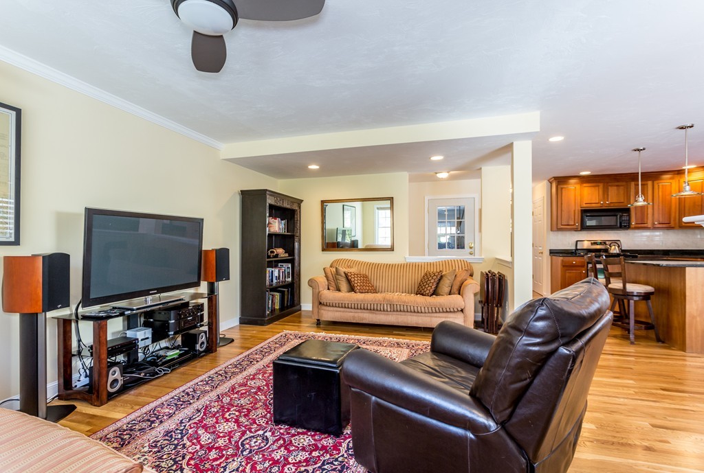 47 Crescent Road, Unit 47 Needham, MA 02494 - Photo 6 of 17 a living room with furniture and a flat screen tv