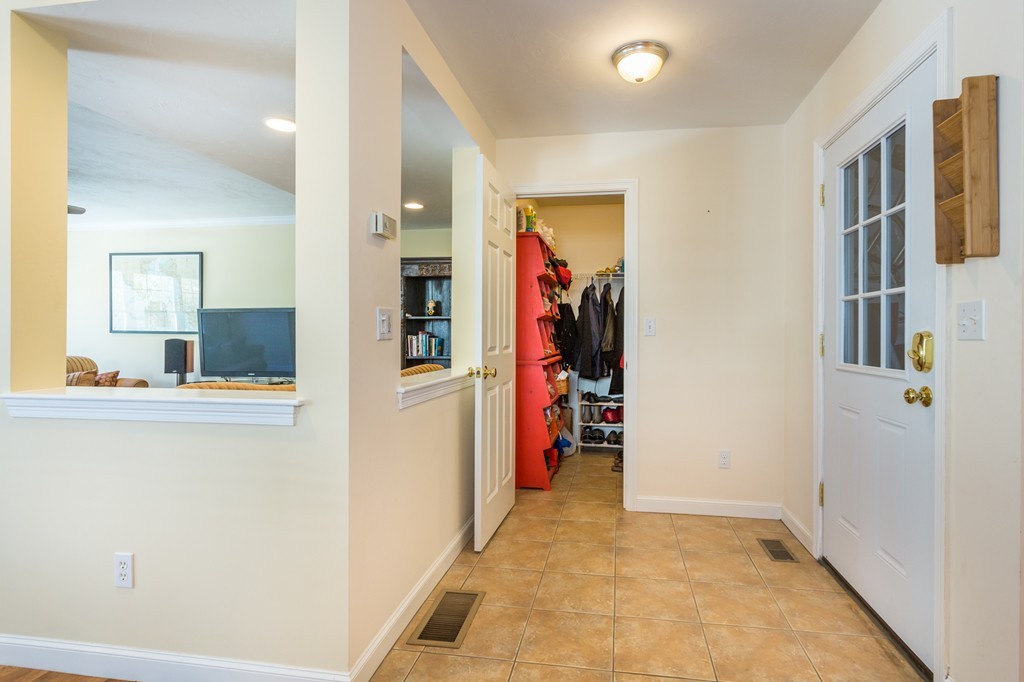 47 Crescent Road, Unit 47 Needham, MA 02494 - Photo 8 of 17 a view of hallway with living room and furniture