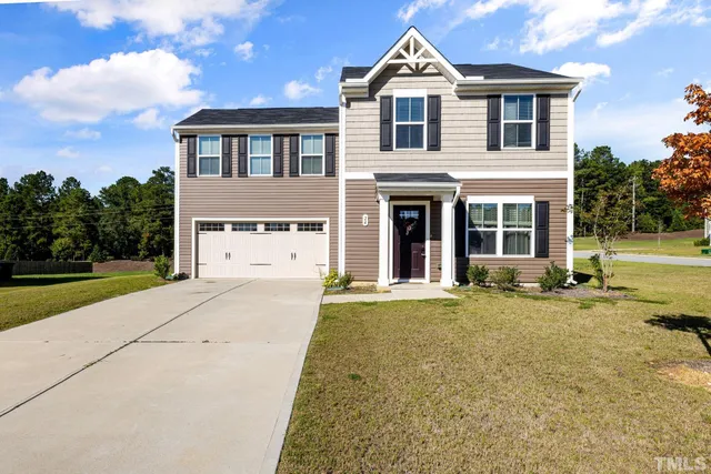 front view of a house with a yard