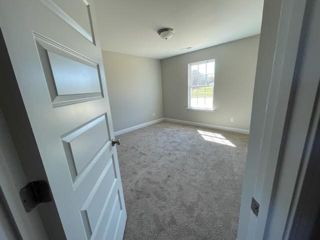 1502 Jack Davis Road Monroe, NC 28112 - Photo 11 of 18 a view of an empty room and wooden floor