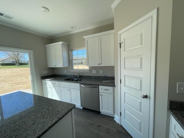1502 Jack Davis Road Monroe, NC 28112 - Photo 4 of 18 a kitchen with stainless steel appliances granite countertop a sink stove and cabinets