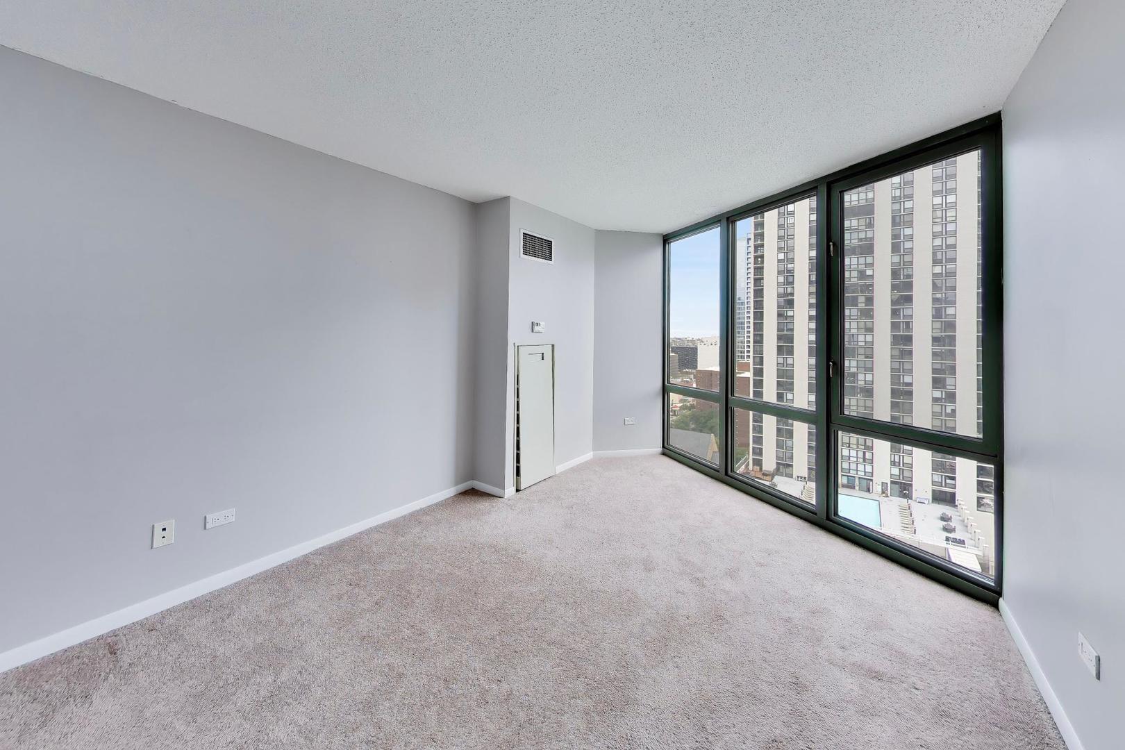 111 West Maple Street, Unit 1503 Chicago, IL 60610 - Photo 19 of 39 a view of an empty room with windows