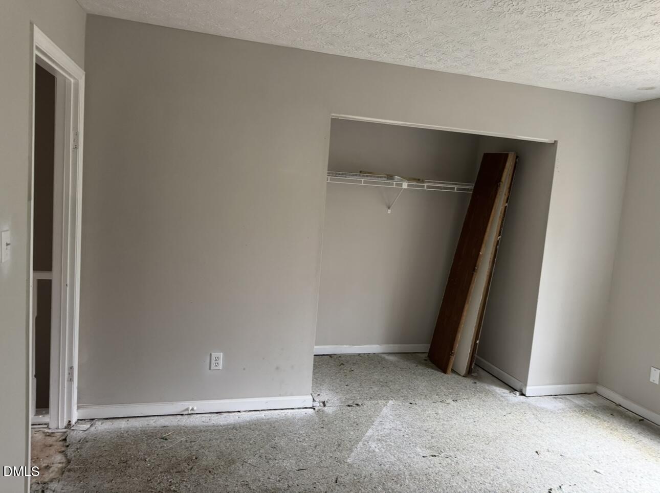 8147 McGuire Drive Raleigh, NC 27616 - Photo 16 of 19 an empty room with a door