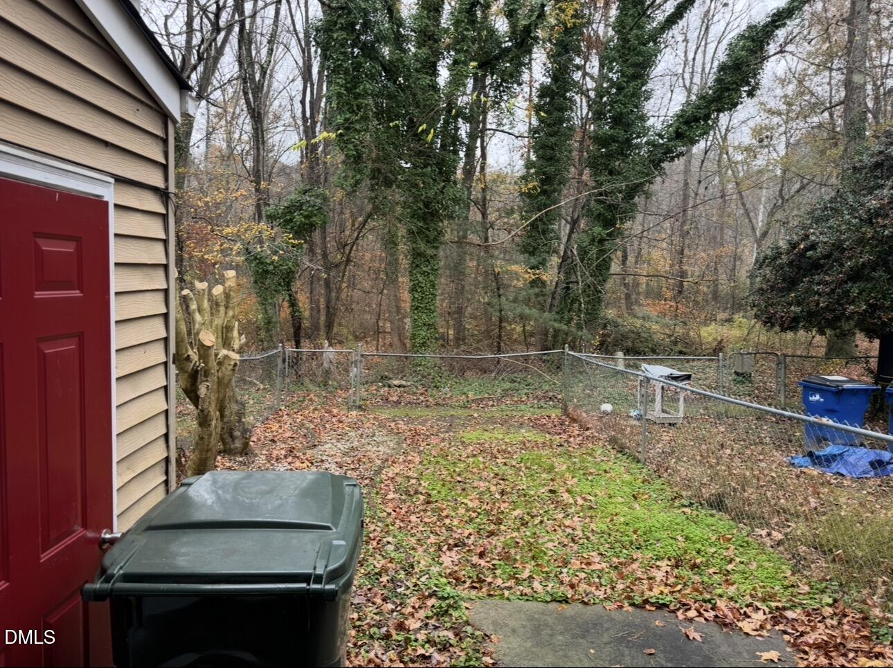 8147 McGuire Drive Raleigh, NC 27616 - Photo 18 of 19 a backyard of a house with lots of green space