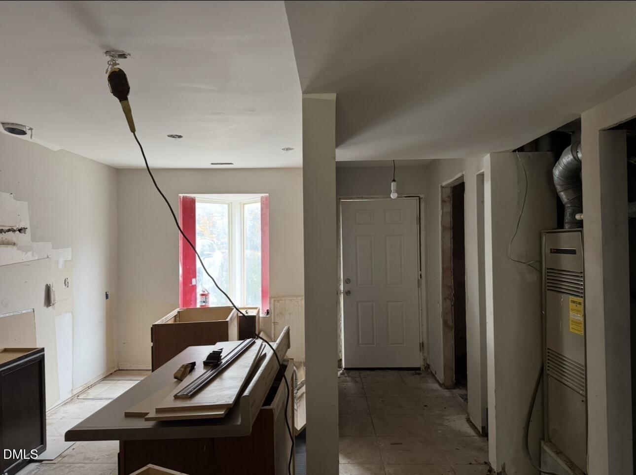 8147 McGuire Drive Raleigh, NC 27616 - Photo 2 of 19 a view of a workspace with furniture and a window