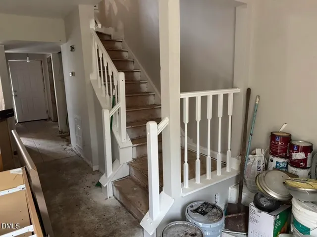 a view of entryway and hall with wooden floor