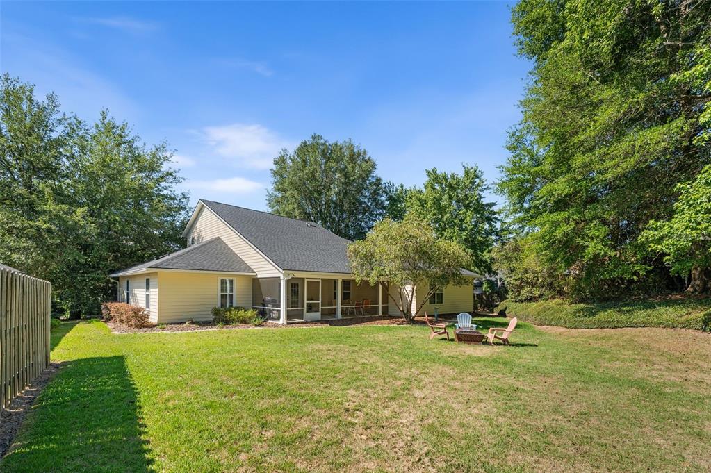 7418 White Oaks Road Alachua, FL 32615 - Photo 36 of 46 a front view of a house with a yard