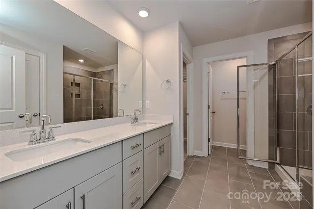a bathroom with a granite countertop sink mirror and double