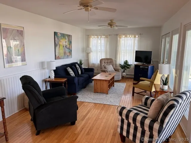 a living room with furniture or couch and a flat screen tv