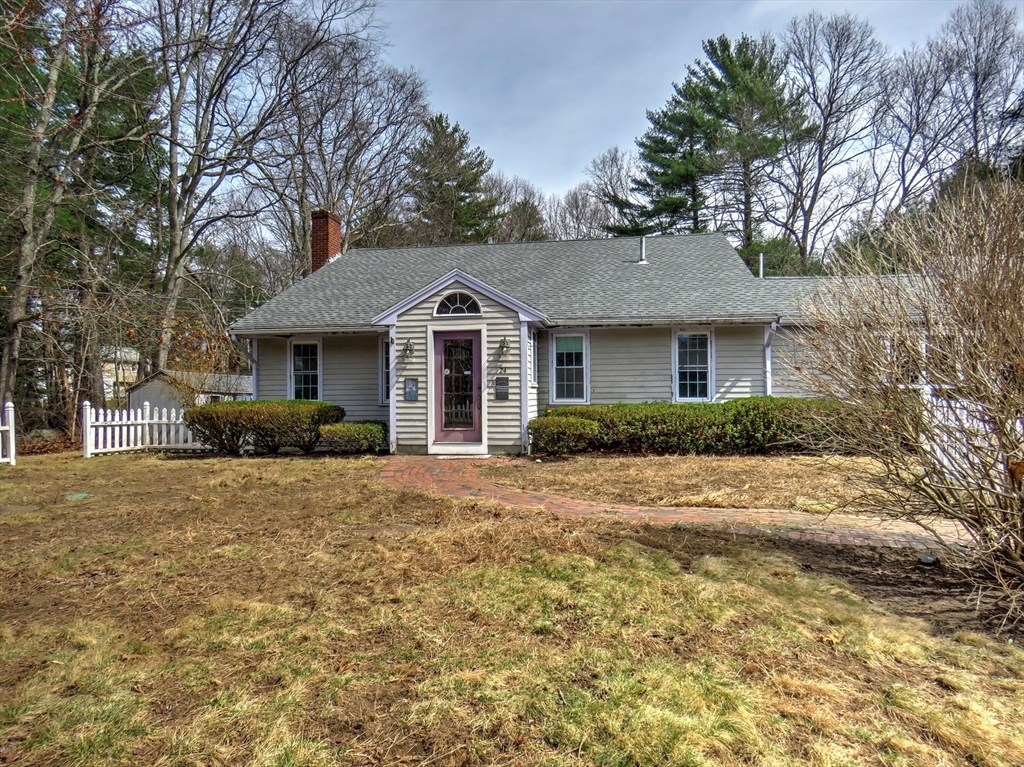 24 Estes Road Hanover, MA 02339 - Photo 1 of 27 a front view of a house with a yard and trees