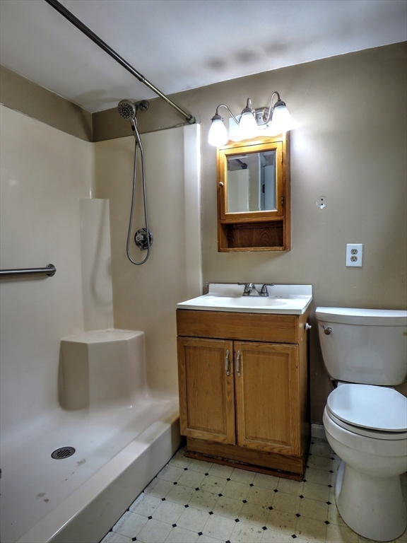 24 Estes Road Hanover, MA 02339 - Photo 11 of 27 a bathroom with a sink a toilet and mirror