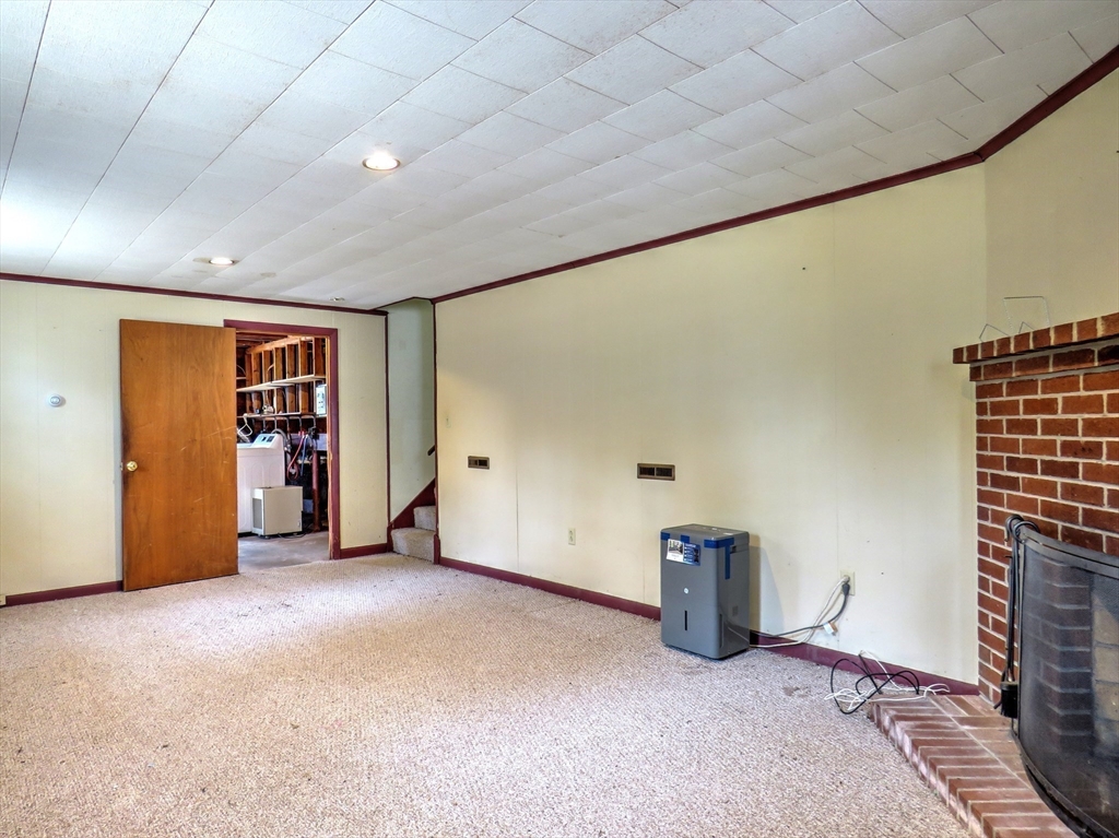 24 Estes Road Hanover, MA 02339 - Photo 21 of 27 a view of a livingroom with a staircase