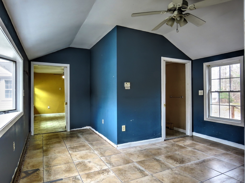 24 Estes Road Hanover, MA 02339 - Photo 9 of 27 an empty room with windows and closet