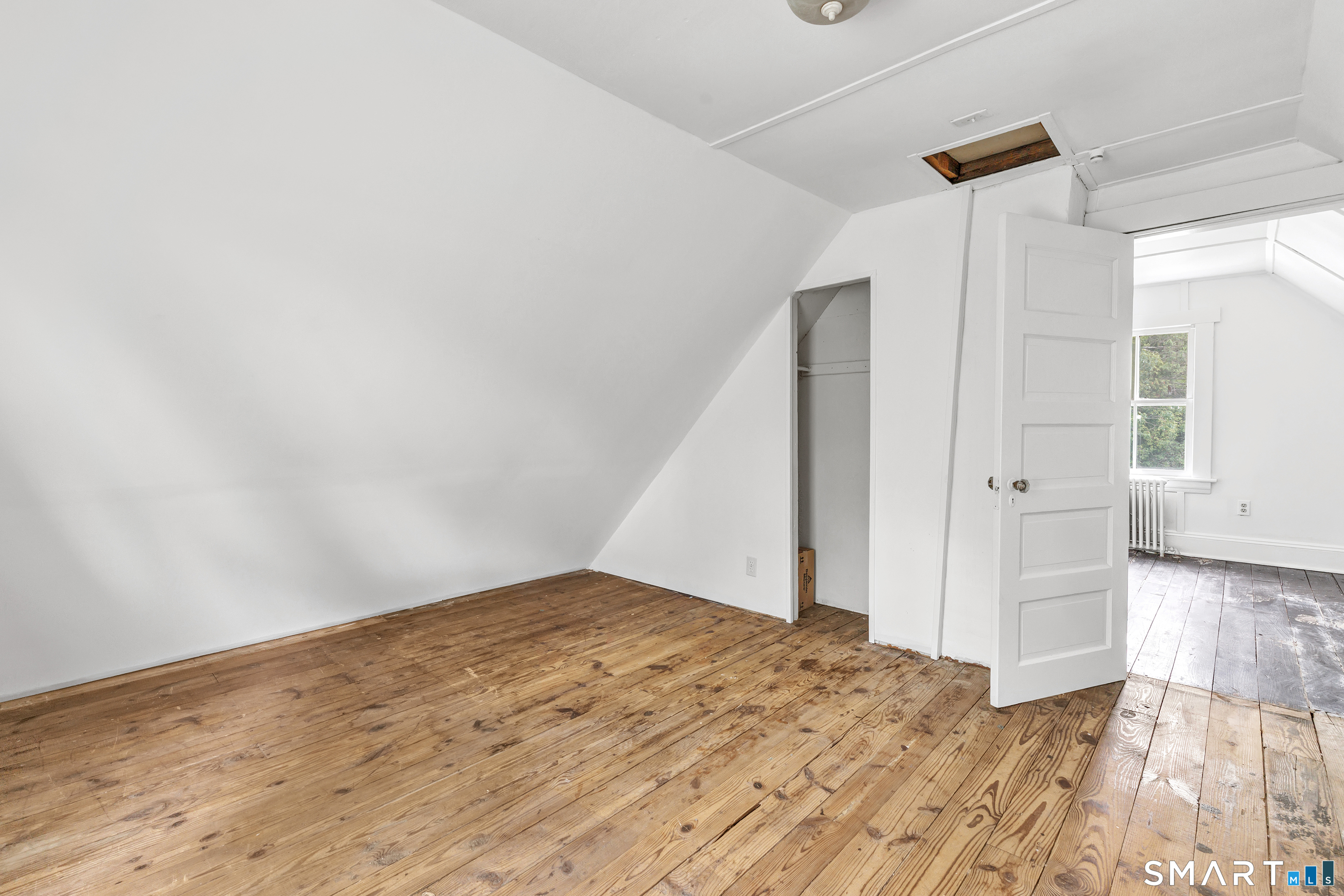 1326 Huntington Road Stratford, CT 06614 - Photo 28 of 37 Walk up Attic - freshly painted and drywalled with original wooden floors.