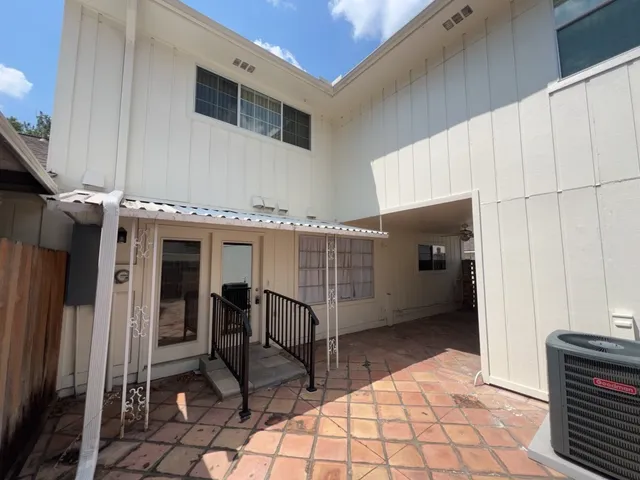 a view of an entryway with wooden walls