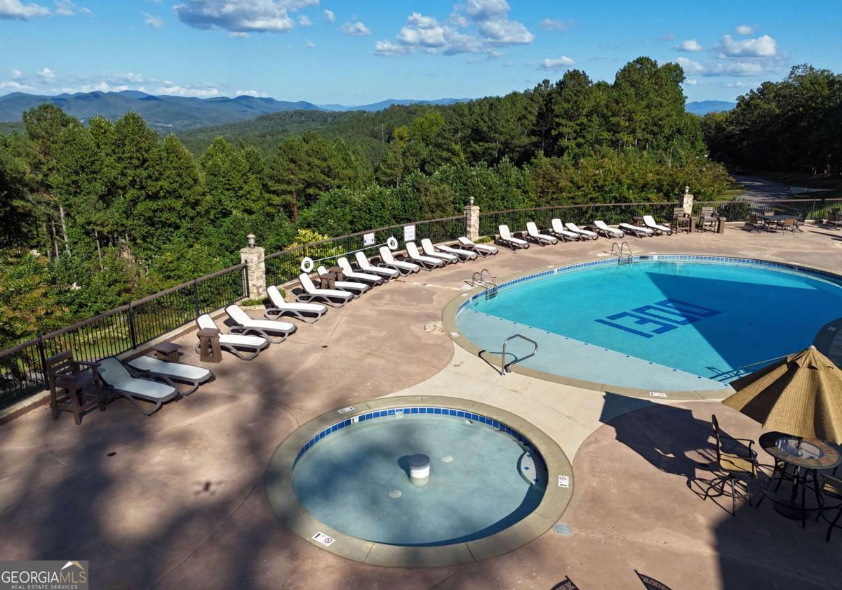 Lot 59 Ridge Peak View Blairsville, GA 30512 - Photo 14 of 49 a view of a swimming pool with a yard and mountain view