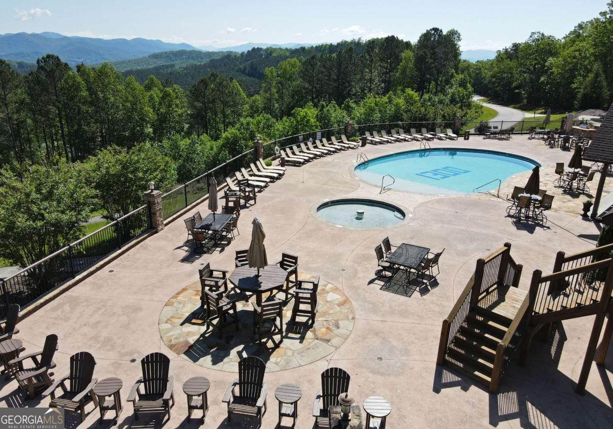Lot 59 Ridge Peak View Blairsville, GA 30512 - Photo 15 of 49 a view of a swimming pool with a lot of flower in it
