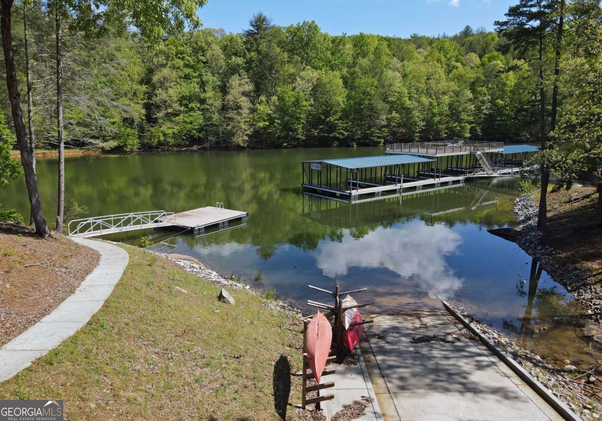 Lot 59 Ridge Peak View Blairsville, GA 30512 - Photo 19 of 49 a view of a lake with a yard and trees