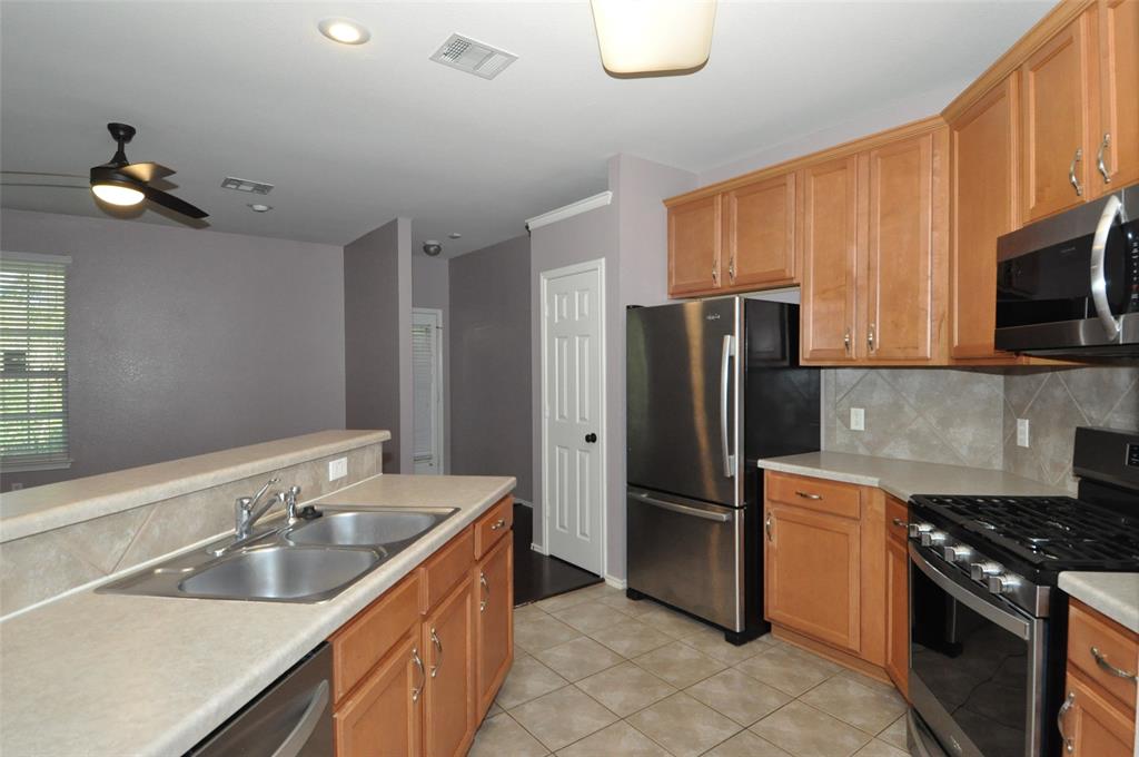1900 Scofield Ridge Parkway, Unit 5403 Austin, TX 78727 - Photo 2 of 26 a kitchen with a sink appliances and cabinets