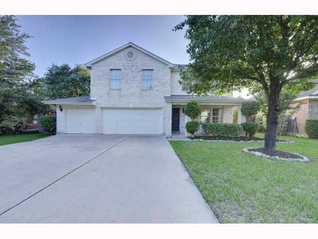 1239 Red Ranch Circle Cedar Park, TX 78613 - Photo 1 of 1 a front view of a house with a yard and a garage