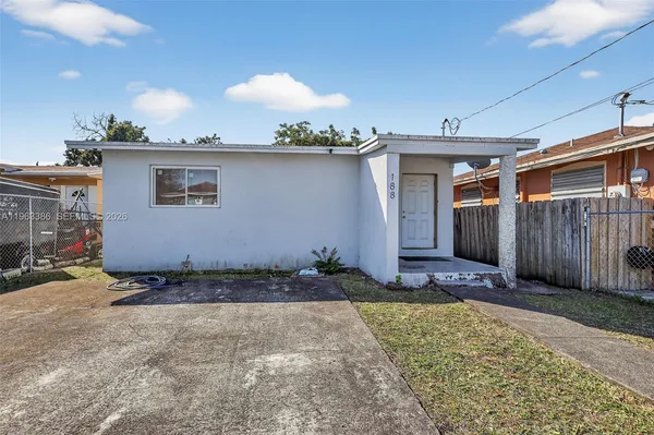 a view of a backyard of the house