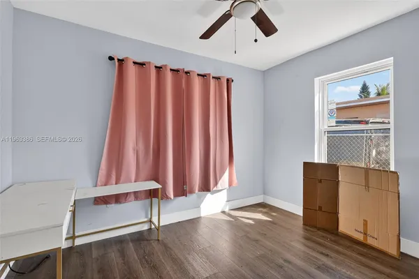 a view of a room with wooden floor and stairs